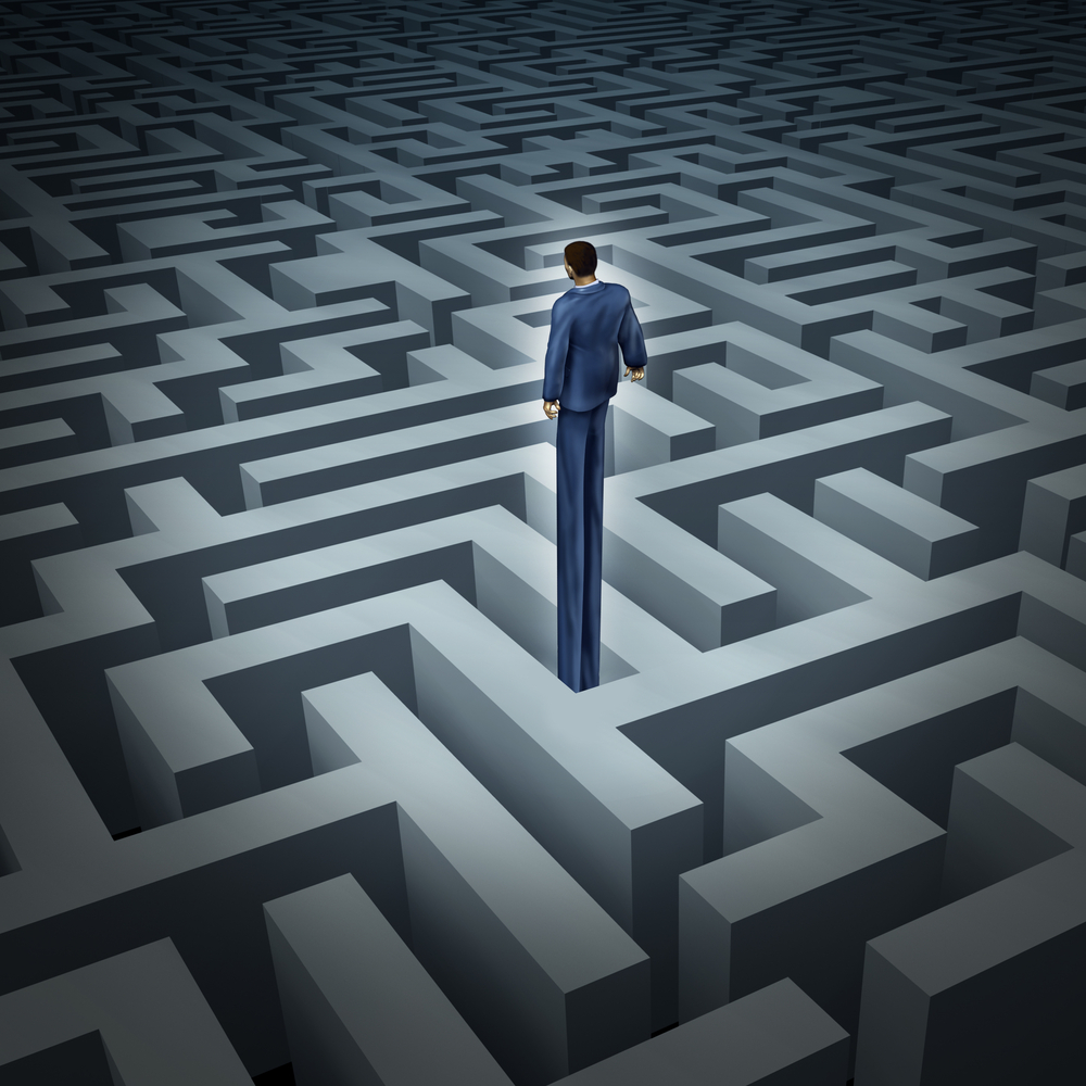 man in a suit with long legs standing in a maze