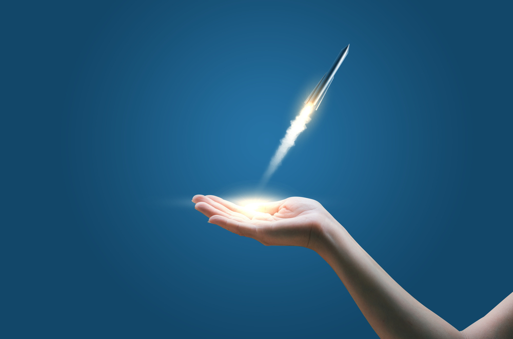 rocket taking off from someone's hand