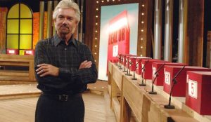 Noel Edmonds and red Deal or No Deal boxes