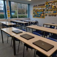 Broker firms donate laptops to local school