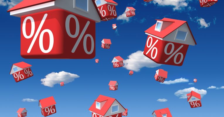 an image of floating housing with percentage signs on them to denote a story about rates