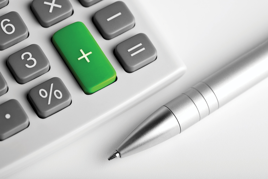 calculator with green button to denote a story about energy efficiency