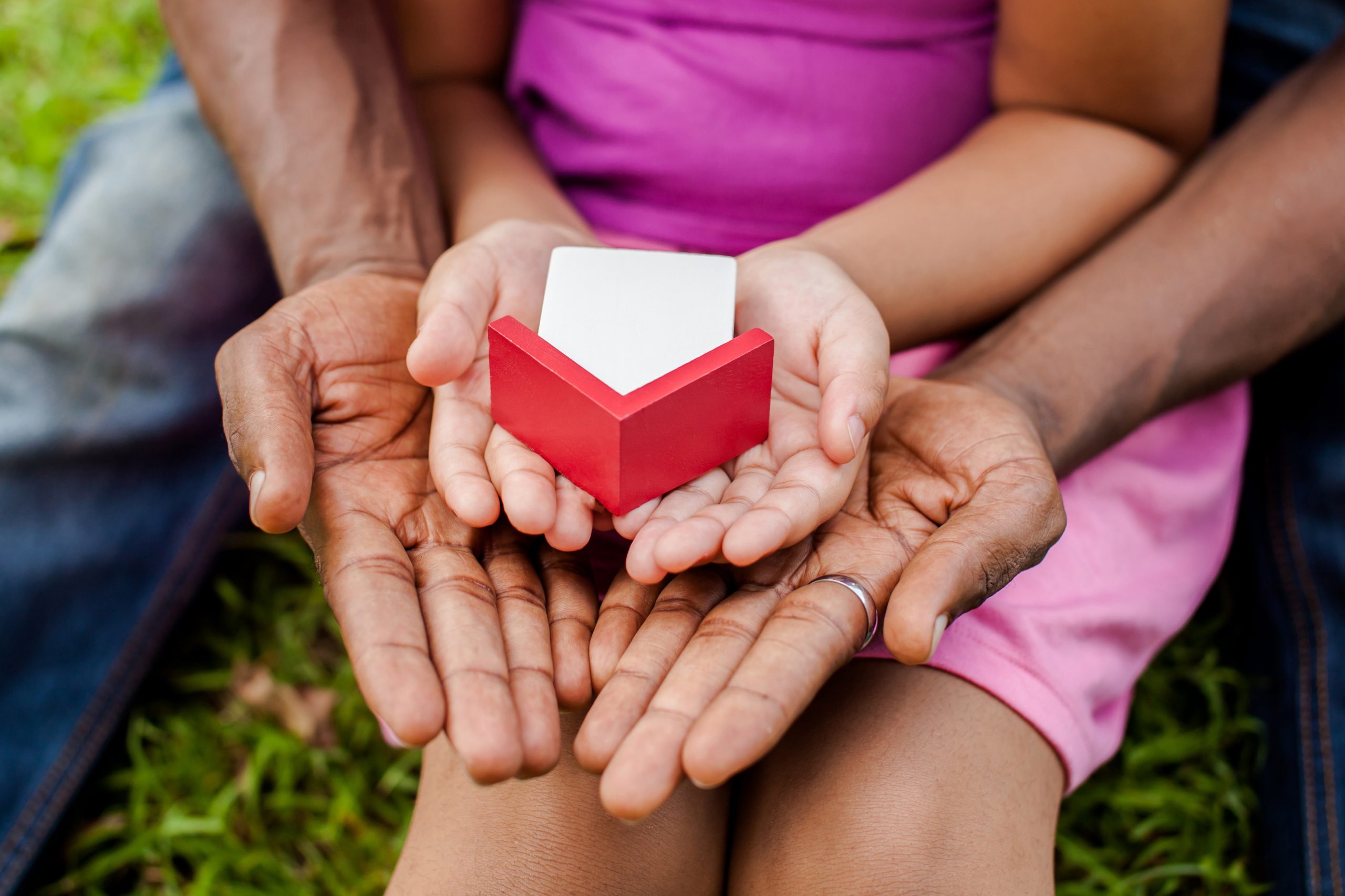 Family plating with toy house to denote Residential by Foundation launching a JBSP offering