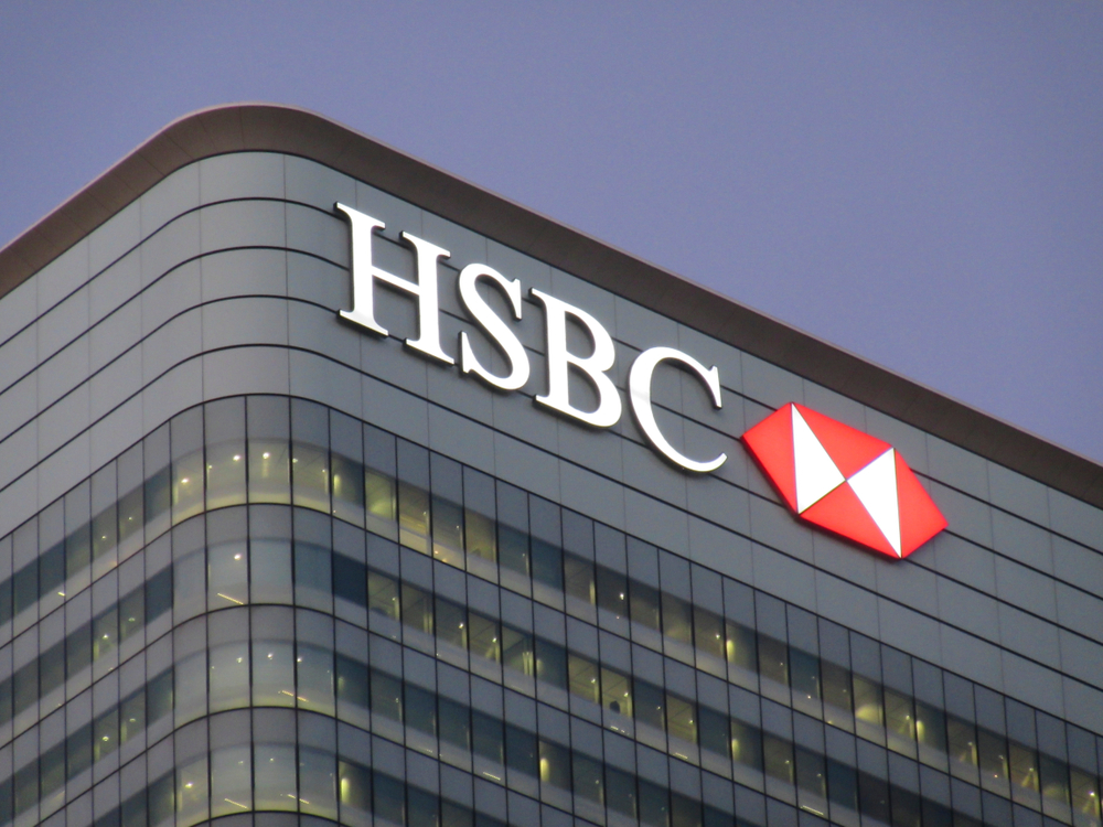 HSBC head office building at night with illuminated logo to denote its PT window