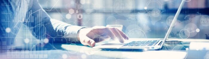 a person on a laptop to denote an inquiry into artificial intelligence (AI) in financial services