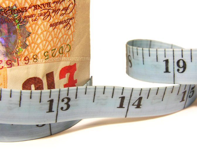 an image of a measuring tape around a bank note to denote a story about the bank rate