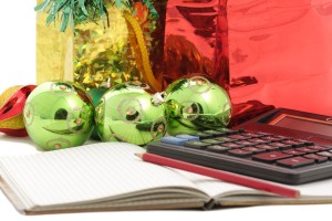 calculator and note pad with Christmas baubles