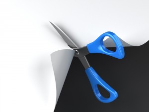 scissors cutting through paper