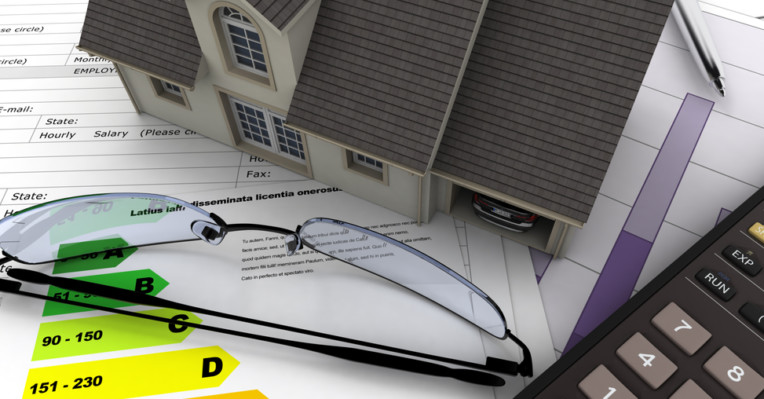 picture of graphs, a model house a pair of glasses and a calculator to denote leasehold costs