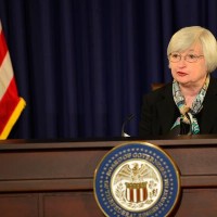 US Fed chair puts brakes on rate rise talk