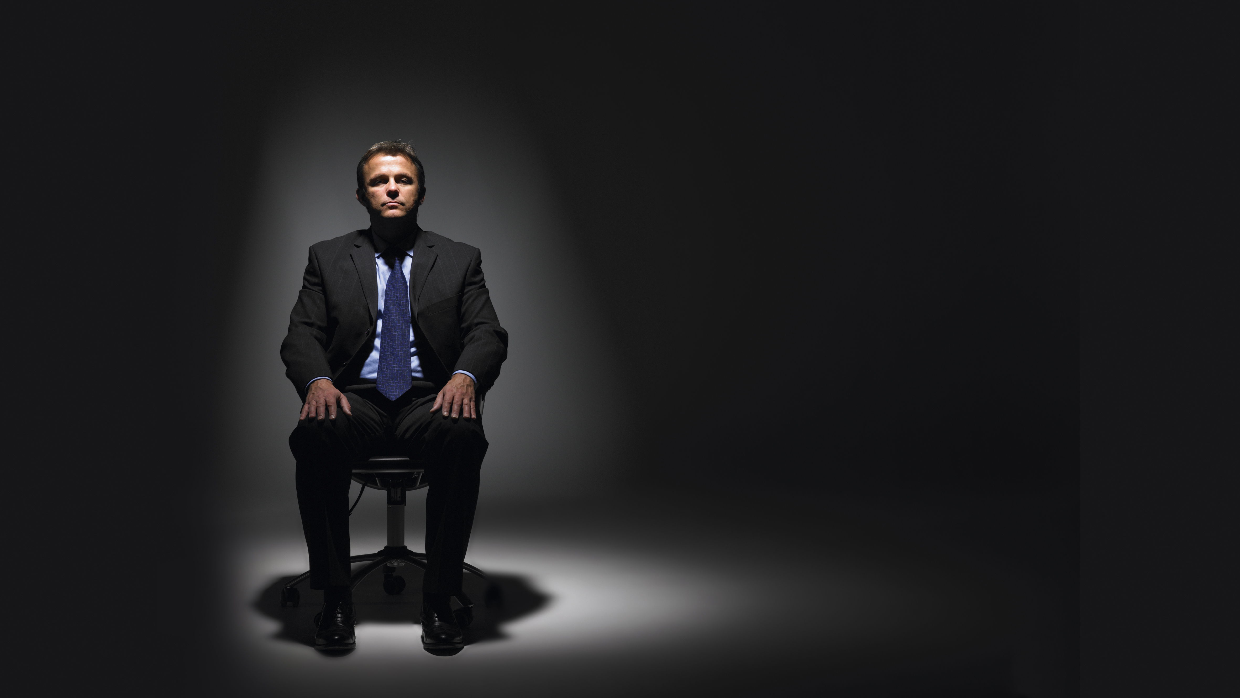business man in spotlight
