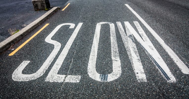 Slow written on a road